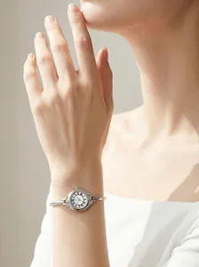 Elegant silver GEDI bangle watch with vintage white Roman numeral dial worn on a wrist