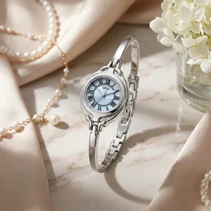 GEDI elegant vintage small round dial bracelet watch with silver finish for women