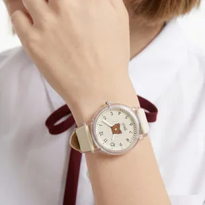 Cute children's quartz wristwatch featuring a cartoon bear dial and cream silicone strap