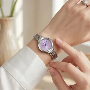 Elegant GEDI women's quartz watch with purple dial and silver steel band on wrist