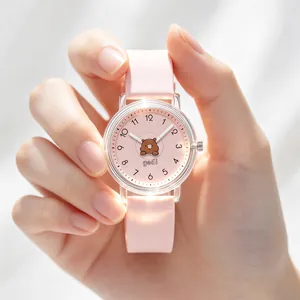 Cute pink cartoon bear kids quartz watch featuring a soft silicone strap for girls