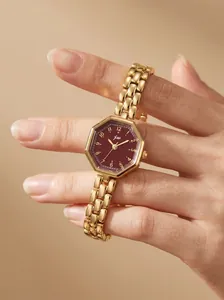 Detail view of an elegant gold octagonal watch with a deep burgundy dial and numerals
