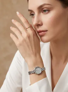 Elegant minimalist octagonal quartz watch with steel strap worn on a woman's wrist
