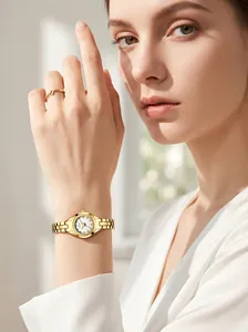 Detailed view of GEDI elegant women's quartz watch with gold-tone steel strap on wrist