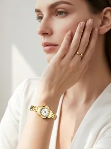 Close-up of GEDI ladies' gold steel quartz watch with diamond markers on a model's wrist