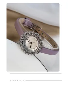 Detailed macro view of a women's sunflower rhinestone watch with a purple leather strap