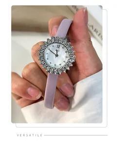 Detail of sunflower-shaped watch with lavender strap and crystal-encrusted bezel
