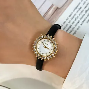 Elegant women's sunflower diamond watch with black leather strap and gold bezel.