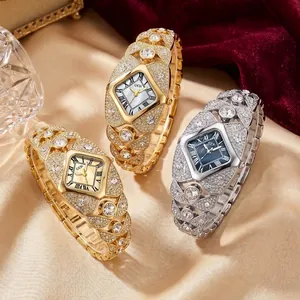 Luxury diamond-encrusted women's quartz watch in elegant gold and silver finishes