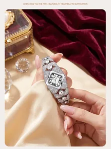 Detailed macro view of a silver diamond-encrusted bracelet watch for women