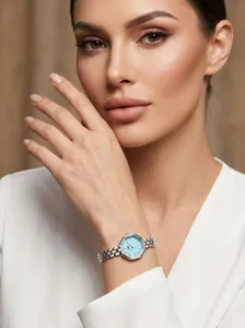 Close-up of elegant octagonal women's watch with light blue dial and silver steel strap