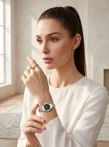 Elegant GEDI women's silver steel watch with rhinestone dial worn by a female model