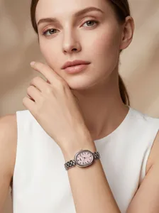 Detail view of vintage oval silver quartz watch with pink numeric dial on female wrist