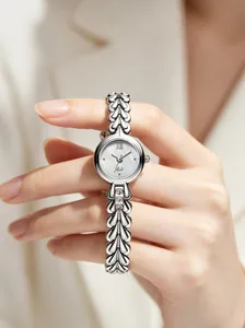 Elegant silver women's quartz watch with mother-of-pearl dial and leaf-shaped metal strap