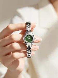 Close-up of GEDI women's quartz watch featuring a green dial and silver steel bracelet