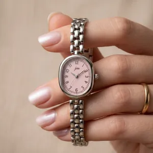 Vintage oval quartz watch with pink dial and silver link chain bracelet for women