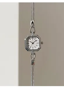 Close-up detail of a vintage square silver quartz watch featuring a delicate mesh strap