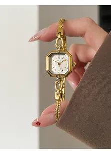 Elegant vintage square gold quartz watch for women with decorative bracelet held in hand