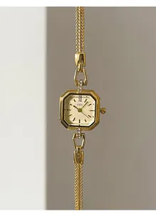 Macro detail of elegant GEDI vintage gold square quartz watch with woven mesh metal strap