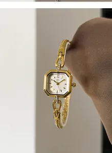 Elegant gold square quartz watch for women featuring a vintage chain strap detail