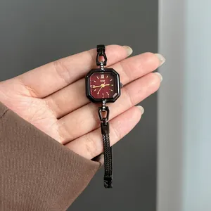 Vintage women's square quartz watch with burgundy dial and black crystal strap