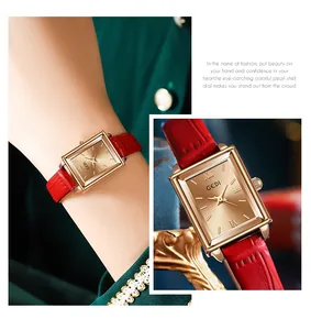 Close-up view of GEDI rectangular gold watch with sunray dial and red leather strap