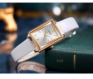 Close-up of Gedi square gold-tone ladies watch with white leather strap
