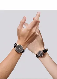 GEDI couple watch set with black leather straps and rose gold cases on wrists