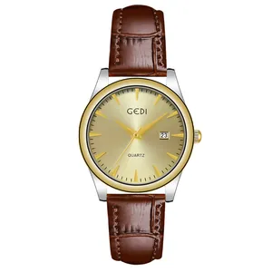 GEDI minimalist brown leather quartz watch with date window and golden sunray dial