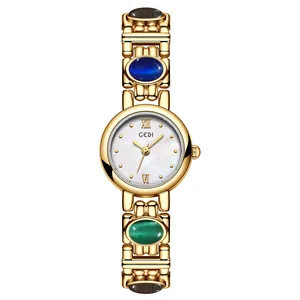 Vintage ethnic style women's bracelet watch with colored stones and gold-tone finish