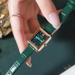 Elegant rectangular quartz watch for women featuring a green leather strap and gold case