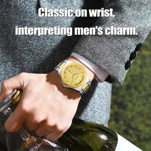 Close-up of BESTWIN gold dial quartz watch on a man's wrist wearing a grey business suit