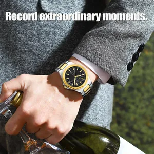 Close-up of a men's business quartz watch with a two-tone steel strap on a wrist.