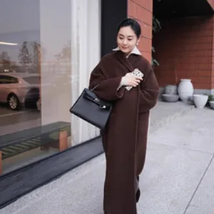 Elegant oversized brown long wool coat for women featuring minimalist street style design