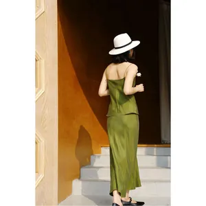 Elegant olive green cupro camisole and fishtail midi skirt set with a back silhouette