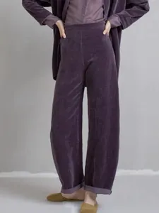 Detailed view of high-end purple velvet casual suit jacket and wide-leg trousers set
