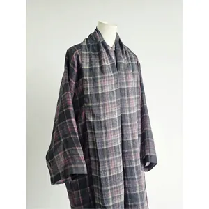Close-up detail of a lightweight purple plaid oversized summer jacket on a mannequin