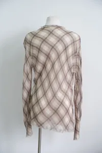 Detail view of brown plaid long sleeve top on white mannequin back