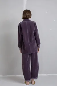 Detailed back view of a purple velvet two-piece set with stand collar top and pants