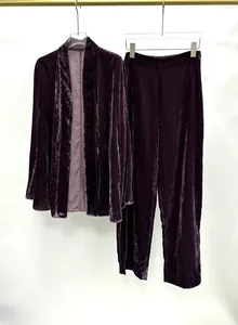 Elegant deep purple velvet two-piece lounge set featuring an open-front jacket and trousers