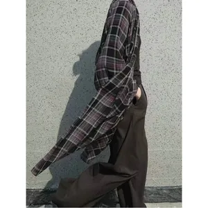 Side view of a lightweight purple plaid sun protection shirt with a relaxed, loose fit.