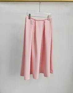 Close-up detail of the pink pleated silk-wool blend A-line midi skirt fabric texture.