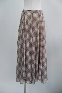 Detailed view of an elegant brown plaid midi skirt featuring a flowing A-line silhouette