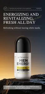 Close-up of KORMESIC men's energy deodorant roll-on bottle on dark rock background