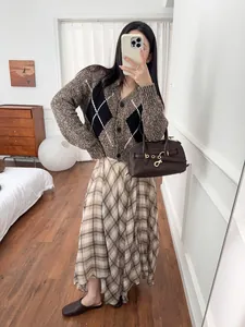 Elegant French style brown plaid midi skirt with a stylish irregular hem design for women