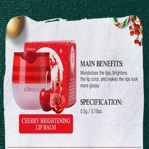 Detail shot of KORMESIC cherry brightening lip balm with festive Christmas packaging.