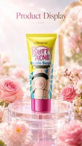 Close-up of KORMESIC butt acne gentle scrub 100g tube displayed with pink roses
