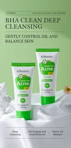 Detail shot of KORMESIC Salicylic Acid Acne Facial Cleanser tubes on elegant white fabric