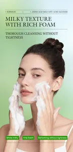 Close-up of rich foam from Kormesic amino acid facial cleanser on model's face.