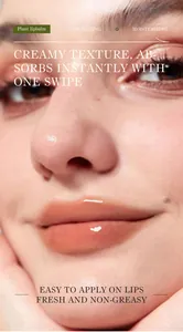 Close-up macro view of moisturizing plant lip balm on lips showing creamy texture and gloss